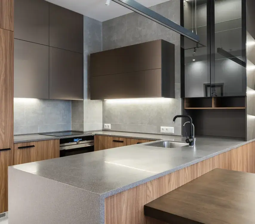 Modern remodeled kitchen with a large island and dark cabinetry