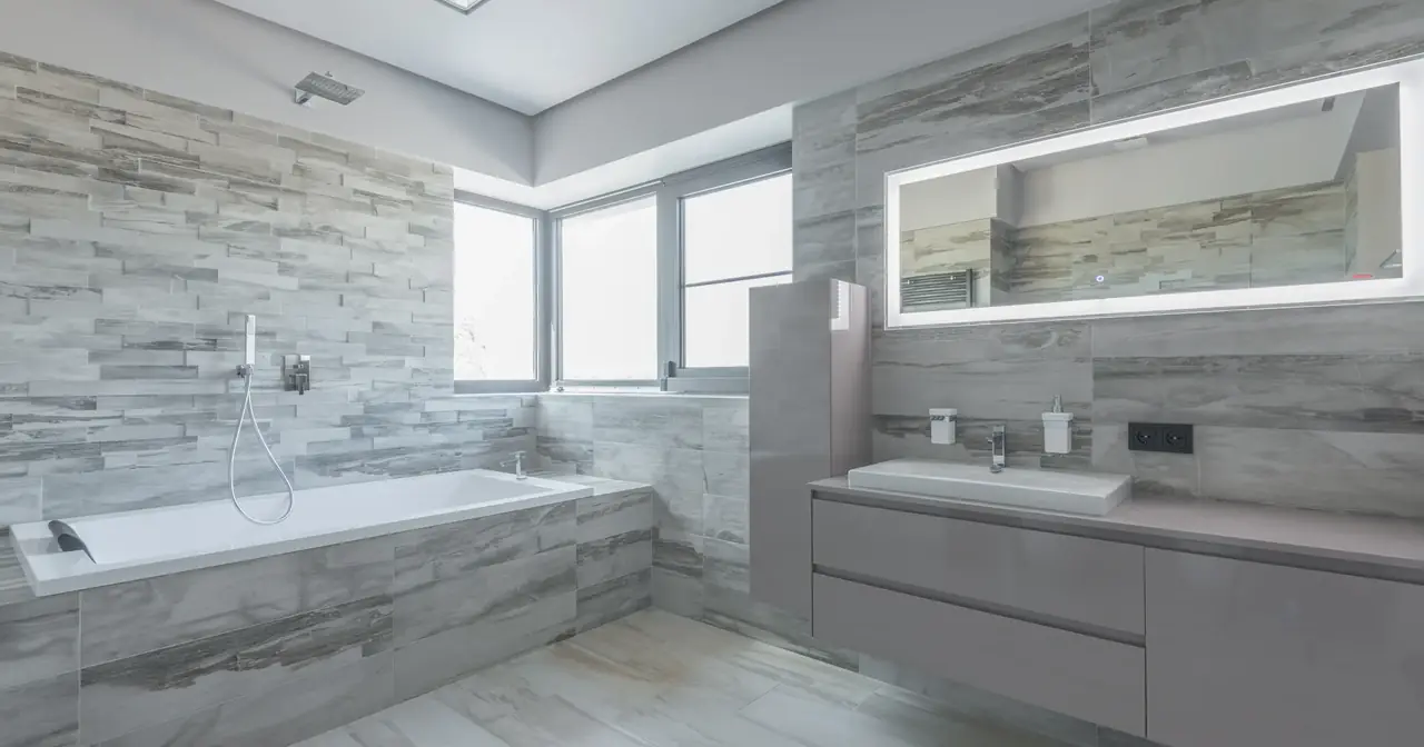 Bright modern bathroom with tiled surfaces